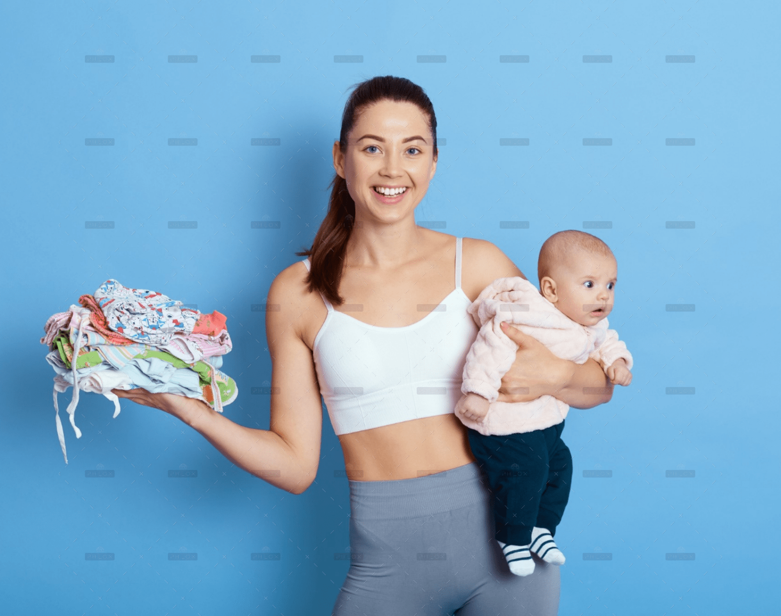 demo-attachment-1708-happy-attractive-mother-with-baby-isolated-blue-background-lady-with-newborn-daughter-looks-camera-w